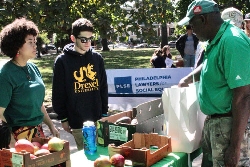Drexel students at free food table in park 